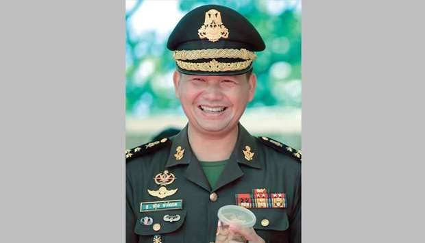 Lieutenant General Hun Manet, the eldest son of Cambodian Prime Minister Hun Sen, smiles during a ground breaking ceremony at the ministry of national defence in Phnom Penh yesterday.