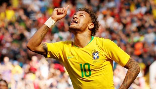 Brazil's Neymar celebrates scoring their first goal