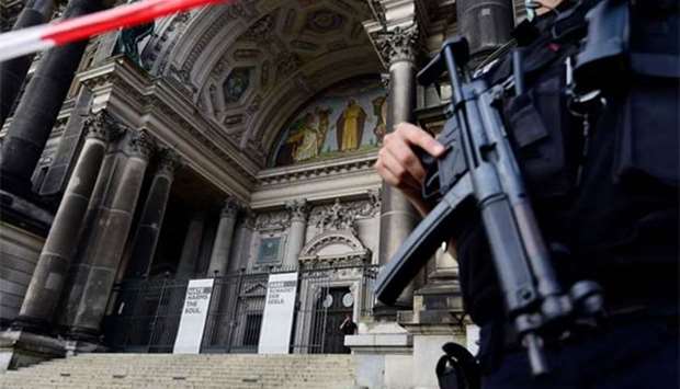 Armed police cordon off the Berlin Cathedral on Sunday following a shooting.