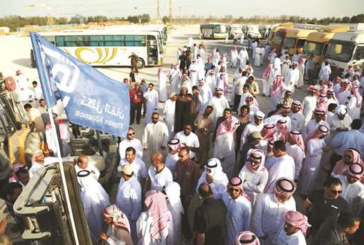 People gather during an auction for vehicles and other possessions belonging to billionaire Maan al-Sanea and his company in Dammam on March 18. AHAB, which has interests as varied as construction, shipping and hospitality, claimed that Maan al-Sanea, who married into the family and managed AHABu2019s finance business, had engaged in unauthorised borrowing in the name of the Algosaibis, forging signatures u201con an industrial scale.u201d Al-Sanea has said the Algosaibis were aware of what he was doing.