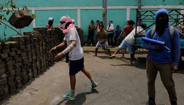 Demonstrators set up a barricade during protests in Monimbo neighborhood in Masaya, some 40km from Managua.