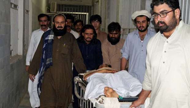 People move a stretcher with an injured man, who was shot after militants attacked on a jirga (tribal assembly or public meeting) organised by the ethnic rights group Pashtun Tahaffuz Movement (PTM) in Wana, the main town in Pakistan's South Waziristan tribal region bordering Afghanistan, in early morning at a hospital in Dera Ismail Khan. Reuters