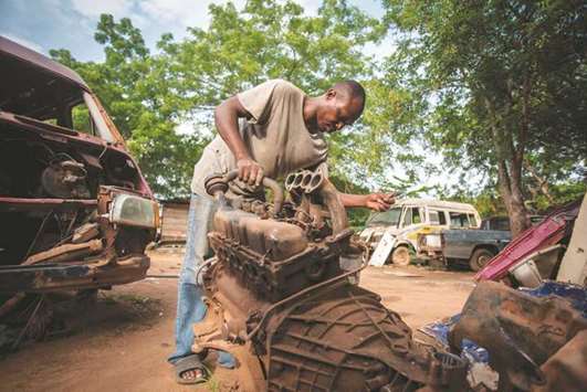 Ernest Yaw Owusu works at his car workshop in Dormaa-Ahenkro in Ghanau2019s Brong-Ahafo region.