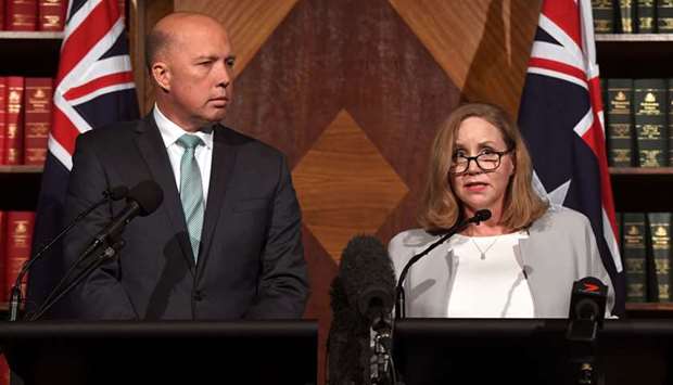 Australiau2019s minister of home affairs, immigration, and border control Peter Dutton (left) speaks during a press conference with Nicole Rose, CEO of Australiau2019s financial intelligence agency AUSTRAC, in Melbourne, yesterday. The Commonwealth Bank agreed to the largest civil penalty in Australian corporate history to settle claims it breached anti-money laundering and counter-terrorism financing laws.