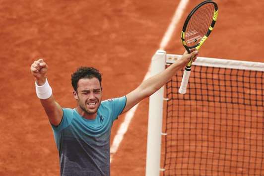 Italyu2019s Marco Cecchinato celebrates winning his quarter-final match against Serbiau2019s Novak Djokovic in the French Open yesterday.
