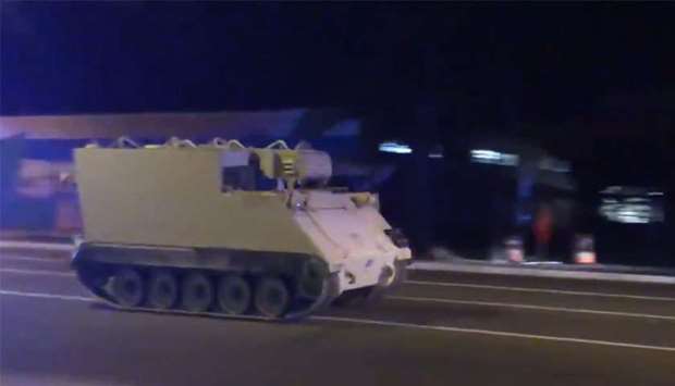 An image grab from a video posted on Twitter that shows the stolen armoured vehicle speeding up
