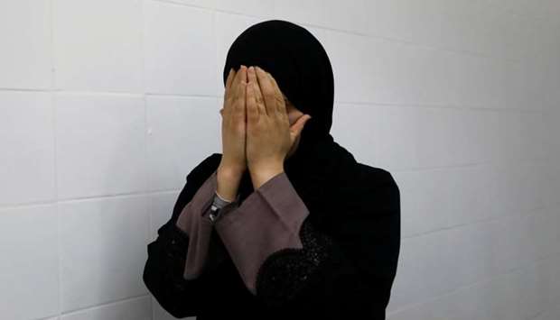 A relative of a Palestinian, who was killed by Israeli troops, reacts at a hospital in Ramallah, in the occupied West Bank