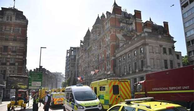 Firefighters tackle a blaze at the Mandarin Oriental hotel in London on Wednesday.