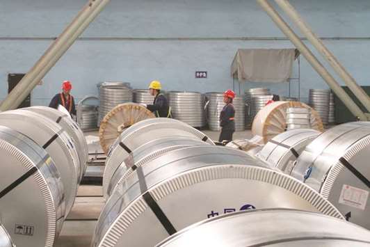 Workers pack cold rolled steel coil at a steel company in Zhangjiagang, Jiangsu province. China, the worldu2019s largest maker, consumer and exporter of steel, is finding it has fewer export options.