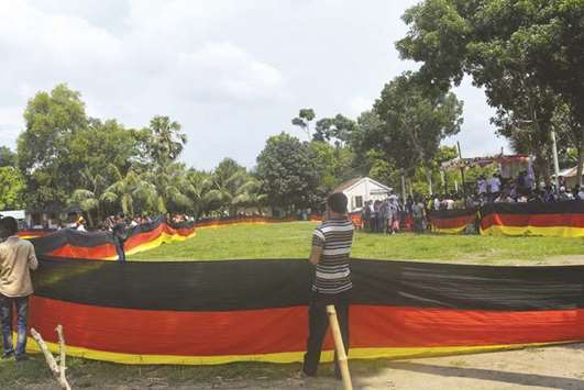 Bangladeshi fans holding a large German flag displayed at a school in Magura, southwest of Dhaka.