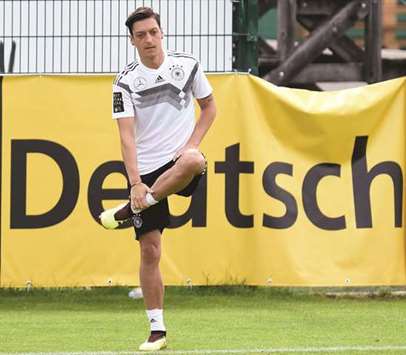 Midfielder Mesut Ozil stretches during a training session for the German national football team at the Rungghof training centre in Eppan, Italy, yesterday. (AFP)