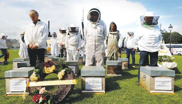 Beekeepers take part in a demonstration at the Esplanade des Invalides in Paris.