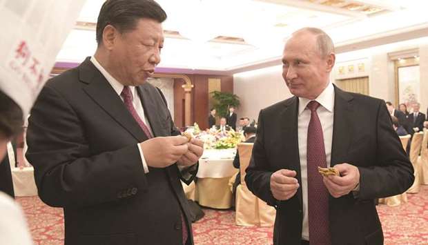 Russian President Vladimir Putin (right) and Chinese President Xi Jinping attend a reception in Tianjin. China has agreed to pursue building next-generation nuclear reactors designed by Russiau2019s Rosatom, the latest player seeking a boost for its new technology from Chinau2019s embrace of atomic power.
