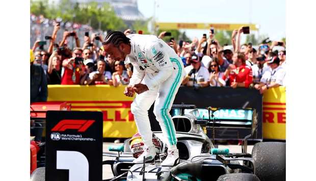 Lewis Hamilton of Great Britain and Mercedes GP celebrates after winning the F1 Grand Prix of Canada at Circuit Gilles Villeneuve in Montreal yesterday.