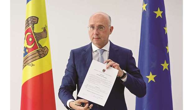 Interim President Filip shows the decree dissolving parliament and ordering a snap election.