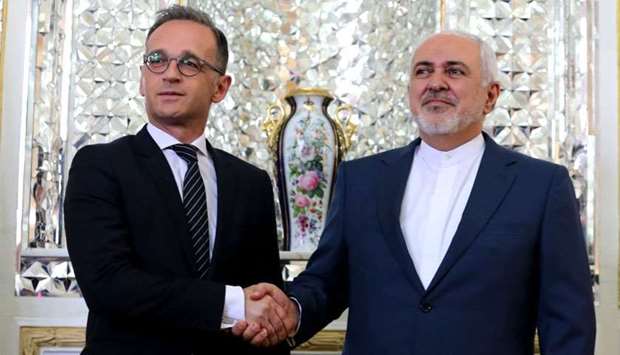 Iran's Foreign Minister Mohammad Javad Zarif (R) receives his German counterpart Heiko Maas in the capital Tehran