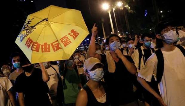 Demonstrators attend a protest to demand authorities scrap a proposed extradition bill with China, in Hong Kong, China