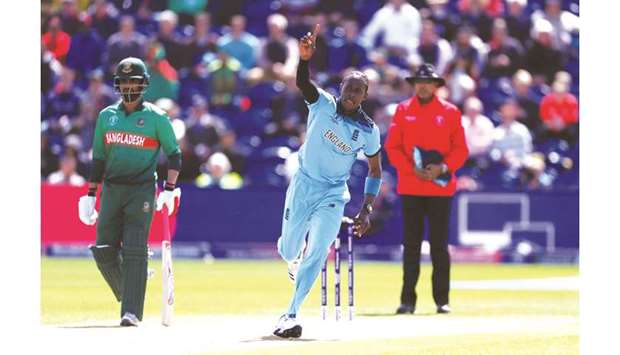 Englandu2019s Jofra Archer (right) celebrates taking the wicket of Bangladeshu2019s Soumya Sarkar (not pictured) during the ICC Cricket World Cup match in Cardiff on Saturday. (Reuters)