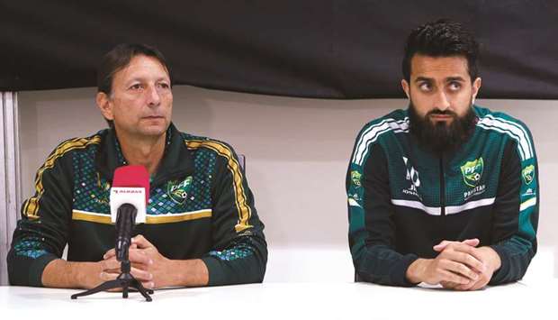 Pakistanu2019s coach Jose Antonio Nogueira (left) and midfielder Hassan Bashir address a press conference in Doha yesterday.