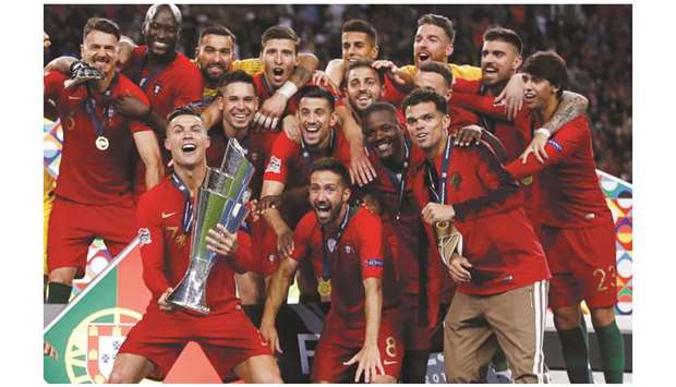 Portugal captain Cristiano Ronaldo celebrates with teammates after winning the UEFA Nations League at the Estadio do Dragao in Porto, Portugal, on Sunday. (Reuters)