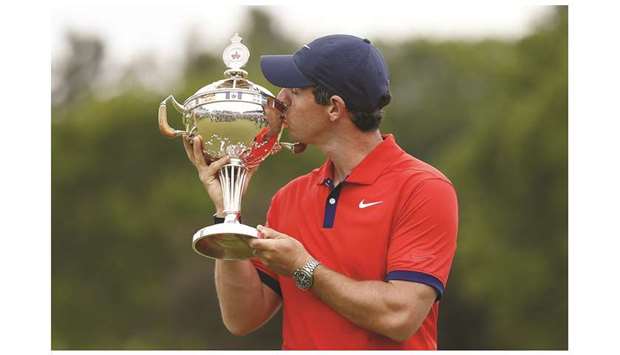 Rory McIlroy of Northern Ireland poses for a photo with the trophy after winning the RBC Canadian Open at Hamilton Golf and Country Club in Hamilton, Canada.