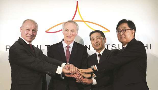 From left: Thierry Bollore, chief executive officer of Renault; Jean-Dominique Senard, chairman of Renault; Hiroto Saikawa, president and chief executive officer of Nissan Motor and Osamu Masuko, chief executive officer of Mitsubishi Motors, pose for photographs during a news conference in Yokohama, Japan (file). Nissan chief executive officer Hiroto Saikawa said it was u201cmost regrettableu201d that Renault planned to stymie board reforms, after receiving a letter from Senard.