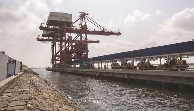 Excavators sit near cranes on a loading jetty at the Port Qasim coal power plant in Sindh province. Amid tight fiscal and contractionary monetary policies, the government of Pakistan is targeting slight improvements in savings and investments, coupled with better performance by agriculture and industry to achieve an economic growth rate of 4% during the next fiscal year, compared to a dismal growth of 3.3% during the current fiscal year.