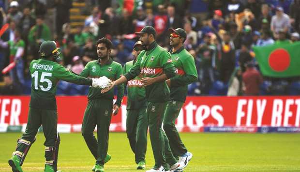 Bangladeshu2019s captain Mashrafe Mortaza (second from right) celebrates with teammates after taking a catch to dismiss Englandu2019s Jason Roy (not pictured) during the match in Cardiff, Wales, on Saturday. (AFP)