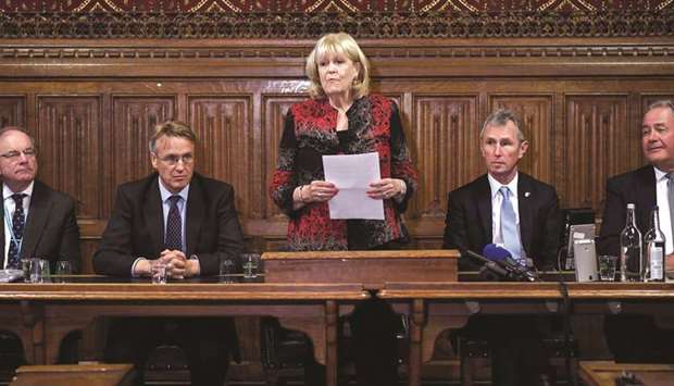 Conservative MP and joint acting chair of the 1922 Committee, Cheryl Gillan, stands alongside Conservative MPs Charles Walker (second left) and Nigel Evans (second right) as she reads out the list of the candidates who will stand in the contest to become leader of the Conservative Party, in the Houses of Parliament in London yesterday.