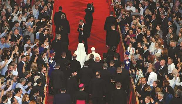 Pope Francis and Patriarch Daniel of Romania arrive at the Cathedral for the Salvation of the Romanian People in Bucharest.