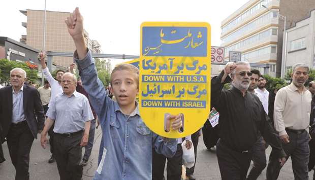 Iranians take part in a protest marking the annual Al-Quds Day (Jerusalem Day) on the last Friday of the holy month of Ramadan in Tehran, yesterday.