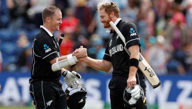 New Zealandu2019s Colin Munro and Martin Guptill celebrate at the end of the match