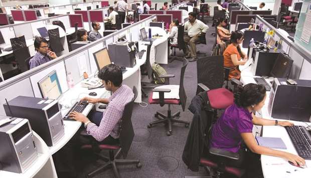 Workers at their workstations on the floor of an outsourcing centre in Bengaluru. India has held the crown of the worldu2019s fastest-growing major economy until recently, but a new study by former chief economic adviser Arvind Subramanian says the expansion was overestimated between 2011 and 2017.