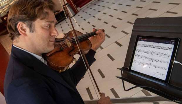 French violinist Renaud Capucon practices with the new application ,NomadPlay,, created by the French start-up Digital Music Solutions, which can replace virtually every orchestral musician