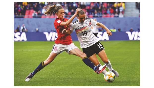 Spainu2019s defender Irene Paredes (left) vies for the ball with Germanyu2019s forward Klara Buhl during the Womenu2019s World Cup Group B match at the Hainaut Stadium in Valenciennes, northern France, yesterday. (AFP)