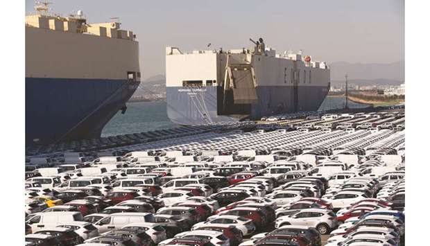Hyundai Motor vehicles bound for export await shipment in front of the Grand Pearl Panama roll-on/roll-off cargo ship  (left), and the Morning Cornella Panama (right), at a port near Hyundai Motoru2019s Ulsan plant in South Korea. The countryu2019s overseas sales dropped 9.4% in May from a year earlier, trade ministry data showed, worse than a median 5.6% loss tipped in a Reuters poll.