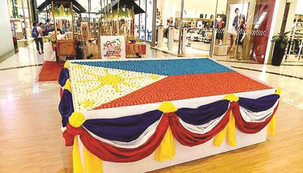 A giant Philippine flag made of 5,000 puto (rice cakes) takes centre stage at Southwoods Mall in Binan, Laguna, as the country commemorated its 121st Independence Day, yesterday.