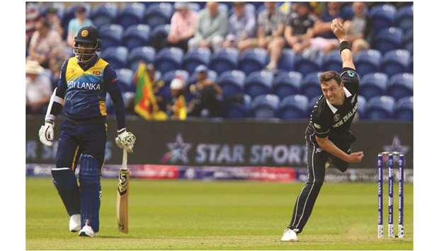 New Zealandu2019s Matt Henry (right) delivers the ball past non-striker Sri Lankau2019s captain Dimuth Karunaratne during the 2019 Cricket World Cup match at Sophia Gardens stadium in Cardiff, Wales, yesterday. (AFP)