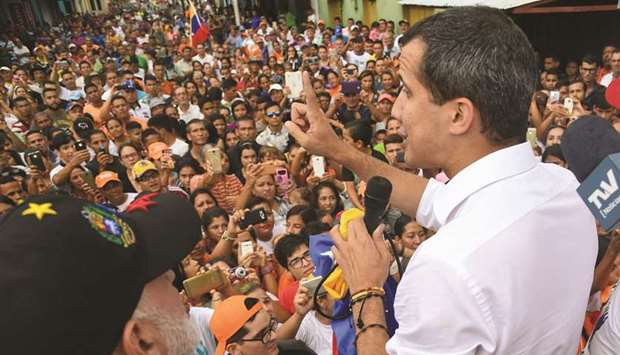 Venezuelan opposition leader and self-proclaimed interim president Juan Guaido speaks to supporters during a rally in Sabaneta de Barinas on Friday.