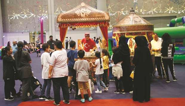 Visitors queue for a taste of Turkish ice cream at the Summer Entertainment City inside the Doha Exhibition and Convention Centre. PICTURE: Jayaram
