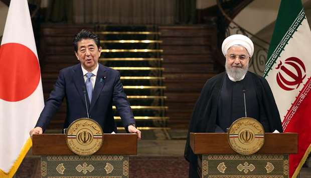 Iranian President Hassan Rouhani and Japanese Prime Minister Shinzo Abe give a joint press conference at the Saadabad Palace in Tehran yesterday.