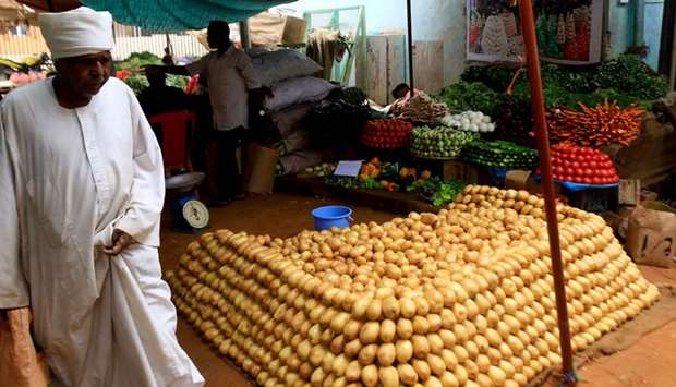Sudanese vendors sell vegetables in the central market of Khartoum.
