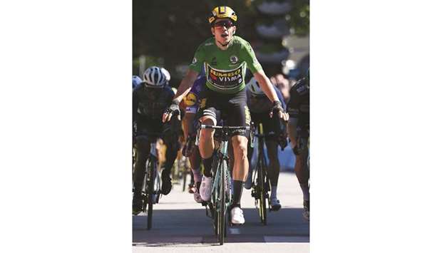 Team Jumbo-Vismarider Belgiumu2019s Wout van Aert celebrates as he crosses the finish line at the end of the fifth stage of the 71st edition of the Criterium du Dauphine cycling race in Voiron yesterday.