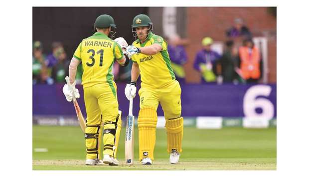 Aaron Finch (right) was dropped by Pakistanu2019s Asif Ali at slip when he was on 33. The Australian captain went on to score 82 and built a 146-run opening stand with centurion David Warner (left) in the match in Taunton, United Kingdom, on Wednesday. (AFP)