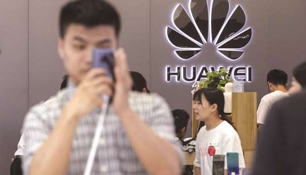 The Huawei logo is displayed at a Huawei store in Shenzhen, China.