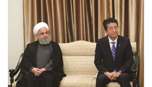 Japanese PM Shinzo Abe next to Iranian President Hassan Rouhani during a meeting in Tehran yesterday.