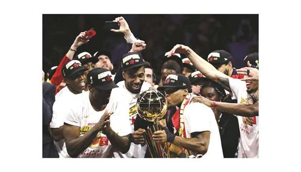 The Toronto Raptors celebrate with the Larry Ou2019Brien Championship Trophy after defeating the Golden State Warriors to win Game Six of the 2019 NBA Finals at Oracle Arena in Oakland, California.
