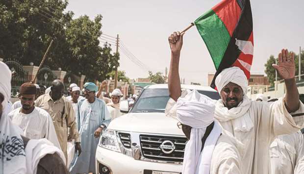 People react as they leave a mosque where Sudanese top opposition leader and former premier Sadiq al-Mahdi attended prayers in Omdurman.