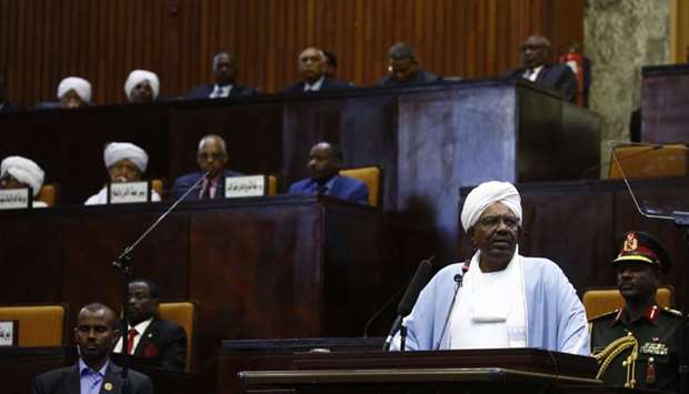 A file photo taken on April 01, 2019 Sudanese President Omar al-Bashir addressing parliament in the capital Khartoum in his first such speech since he imposed a state of emergency across the country