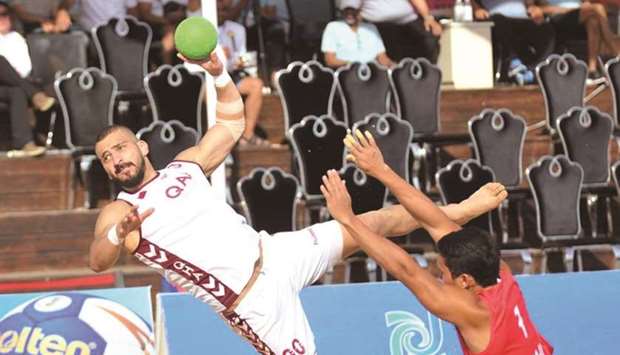 A Qatari player scores against Philippines during the 7th AHF Asian Beach Handball Championship in Weihai, China, yesterday.